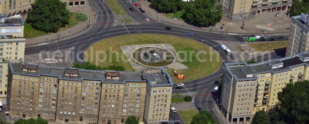 Aerial image Berlin Friedrichshain - View of the Strausberger Platz with fountain in the district Friedrichshain of Berlin. The Strausberger Platz marks the border to the borough Mitte. The place was arranged 1967 after a fountain, designed by Fritz Kühn, had been constructed