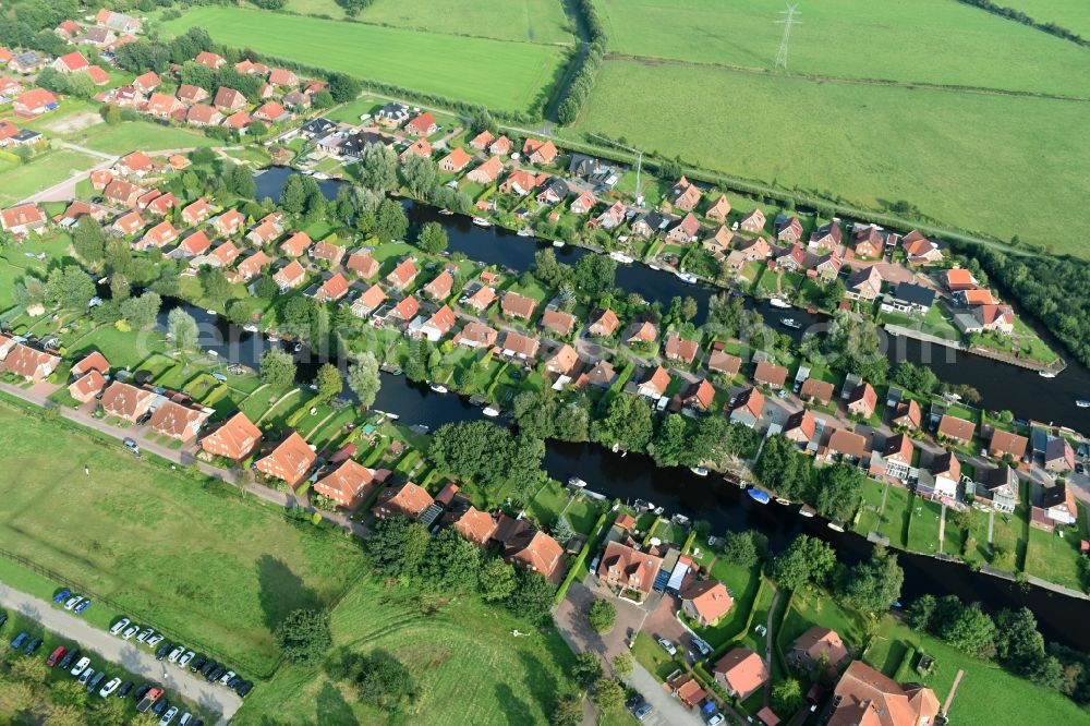 Aerial image Timmel - Settlement Oevert - canal to Timmeler Meer in Timmel in the state Lower Saxony