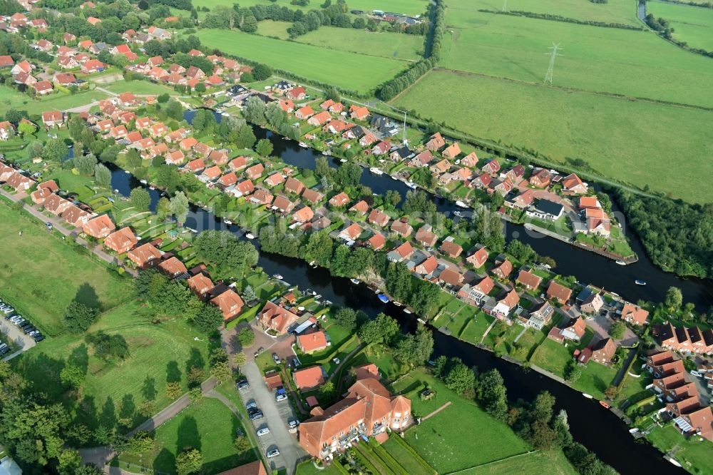 Aerial photograph Timmel - Settlement Oevert - canal to Timmeler Meer in Timmel in the state Lower Saxony