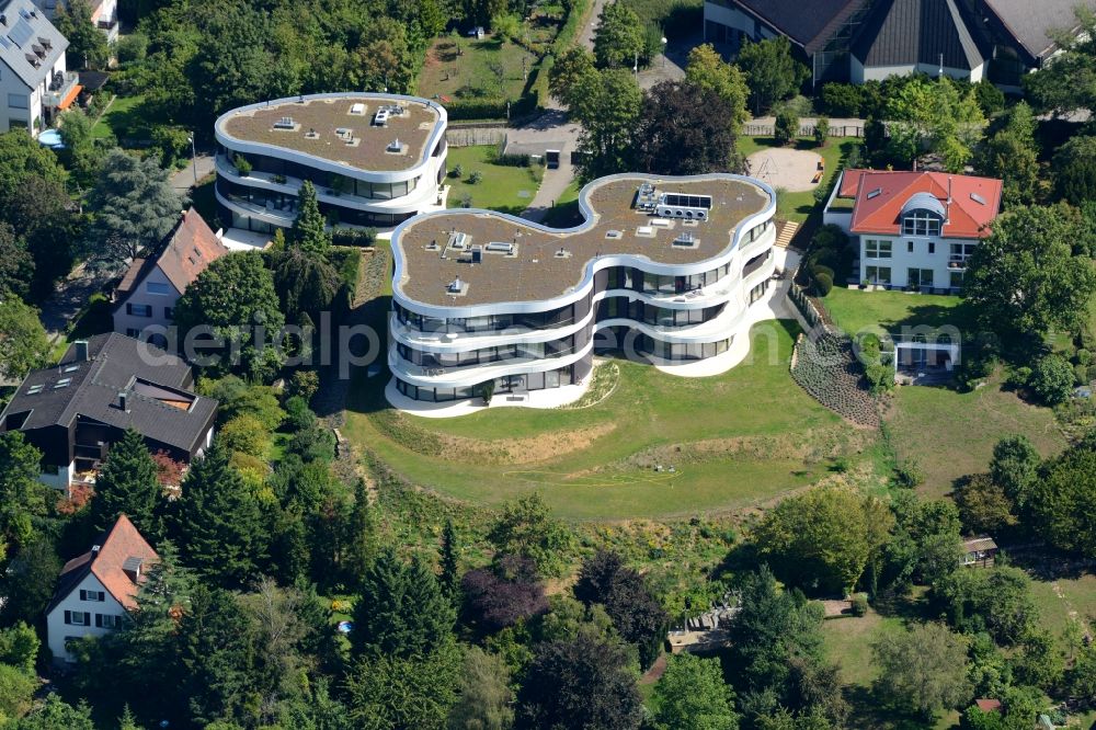 Stuttgart from above - Residential estate View on Memberg mountain in the Geiger residential area in Stuttgart in the state of Baden-Wuerttemberg. The estate consists of three buildings with balconies and round and bent architecture