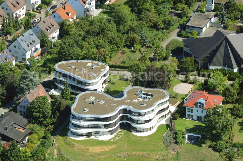 Aerial photograph Stuttgart - Residential estate View on Memberg mountain in the Geiger residential area in Stuttgart in the state of Baden-Wuerttemberg. The estate consists of three buildings with balconies and round and bent architecture