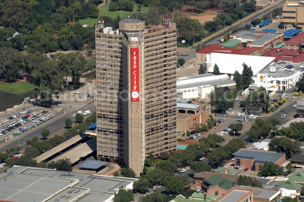 BLOEMFONTEIN from above - Residental building with advertisement poster near Loch Logan in Bloemfontein, South Africa. Because of its prosperity of flowers and the annual Rose Festival, Bloemfontein has the sobriquet Rose City ( text on the poster )