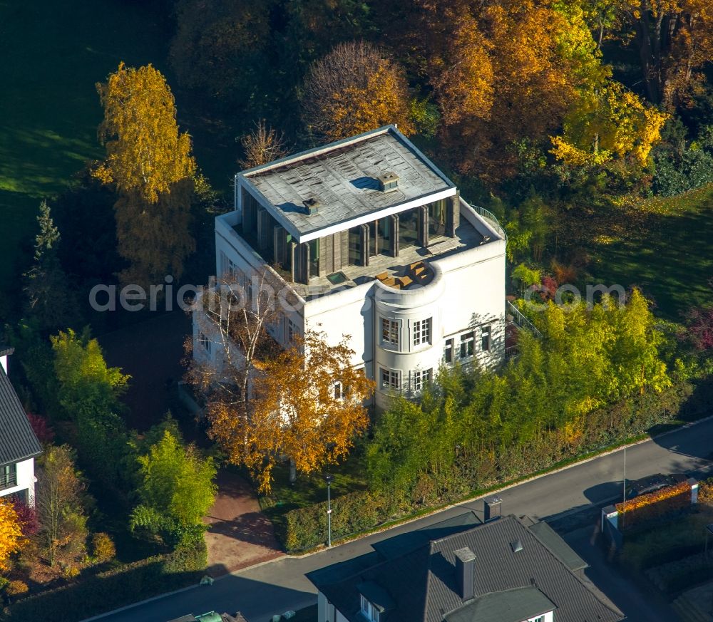 Neheim from above - Residential building mansion in Neheim in the state of North Rhine-Westphalia. The architectural distinct building is located between colourful trees in the West of Neheim