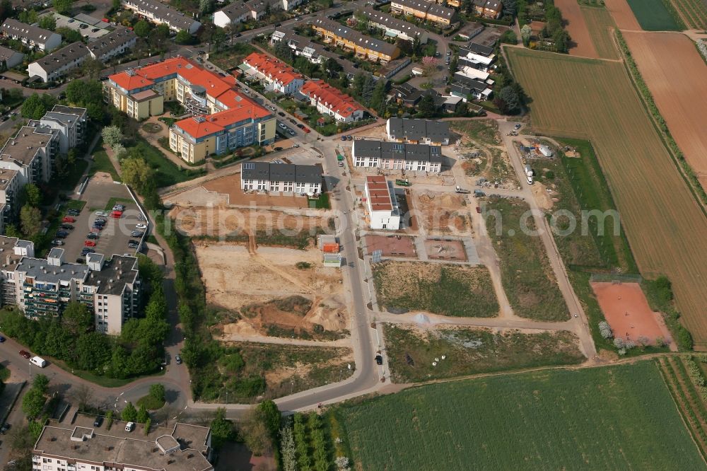 Mainz from the bird's eye view: View of the Finthen district of Mainz in the state of Rhineland-Palatinate. The most Western district includes several residential areas and estates and is surrounded by fields, meadows and wooded hills