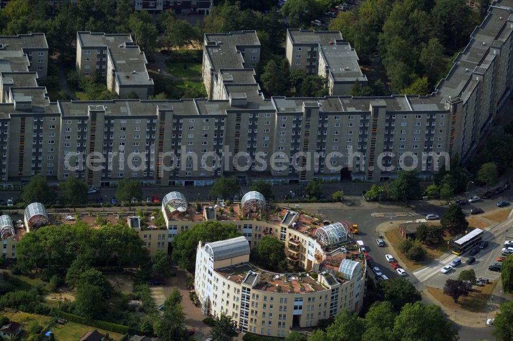 Berlin from the bird's eye view: Residential building complex Snail on Ortolanweg in the Neukoelln part of Berlin. The architectural distinct building is located amidst a residential area with estates