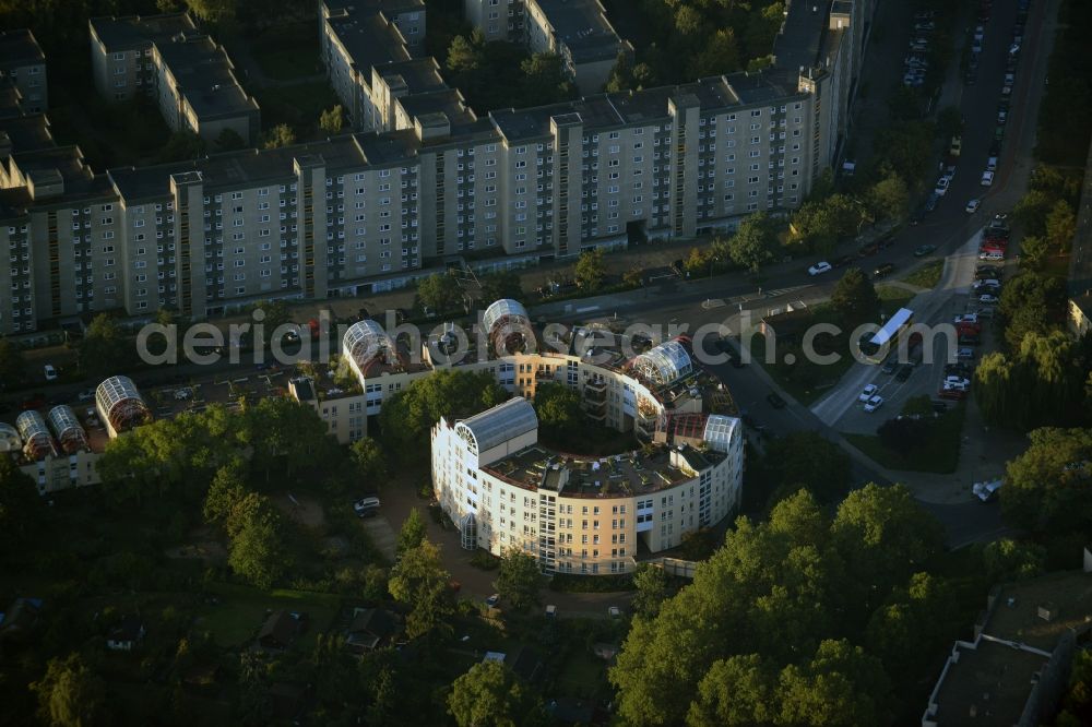 Berlin from the bird's eye view: Residential building complex Snail on Ortolanweg in the Neukoelln part of Berlin. The architectural distinct building is located amidst a residential area with estates