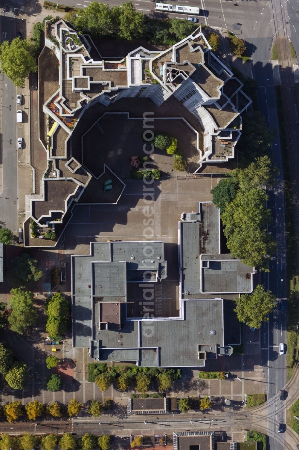 Gelsenkirchen from above - View onto the residential tower Weißer Riese in Gelsenkirchen in the state North Rhine-Westphalia. In front of the White Giant the building of the adult education centre with the city library is located