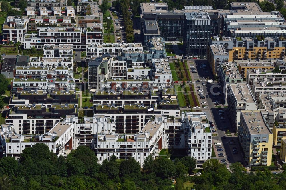 Aerial photograph Warschau - Residential neighbourhood and buildings in the Wygledow part of the district of Mokotow in Warsaw in Poland. The differently shaped and coloured blocks of flats and estates are surrounded by allotments. The compound is located South of the Mokotow fields, a public green and Park with a small pond