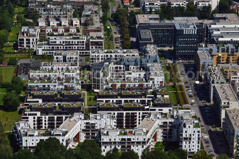 Warschau from above - Residential neighbourhood and buildings in the Wygledow part of the district of Mokotow in Warsaw in Poland. The differently shaped and coloured blocks of flats and estates are surrounded by allotments. The compound is located South of the Mokotow fields, a public green and Park with a small pond