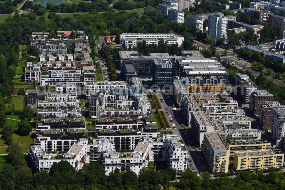 Warschau from the bird's eye view: Residential neighbourhood and buildings in the Wygledow part of the district of Mokotow in Warsaw in Poland. The differently shaped and coloured blocks of flats and estates are surrounded by allotments. The compound is located South of the Mokotow fields, a public green and Park with a small pond