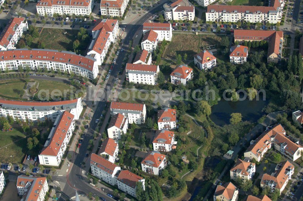 Aerial photograph Berlin - Blick auf Mehrfamilienhäuser zwischen Schönerlinder Weg, der Autobahn A10 / E65, Karestraße und der Bucher Chaussee in Berlin-Karow-Nord.