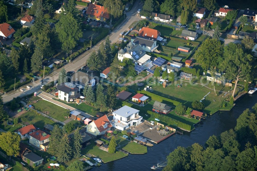 Berlin from above - Residential houses and allotments on Mueggelspree river in the Hessenwinkel part of Berlin in Germany