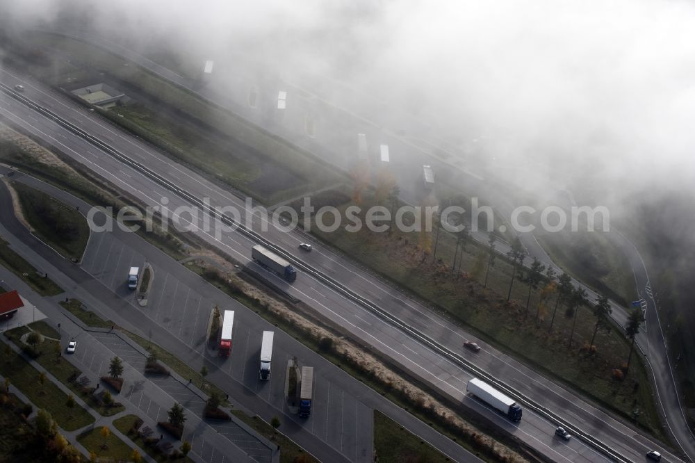 Spreenhagen from the bird's eye view: Routing and traffic lanes during the motorway service station and parking lot of the BAB A 12 E30 fuer LKW Lastkraftfahrzeuge im Gueterverkehr in Spreenhagen in the state Brandenburg