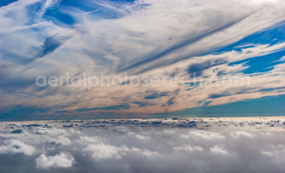 Lindewitt from above - Clouds over Lindewitt in Schleswig-Holstein, Germany. Weather conditions with cloud formation. Flight above the inversion layer. Cirrus - Cloud