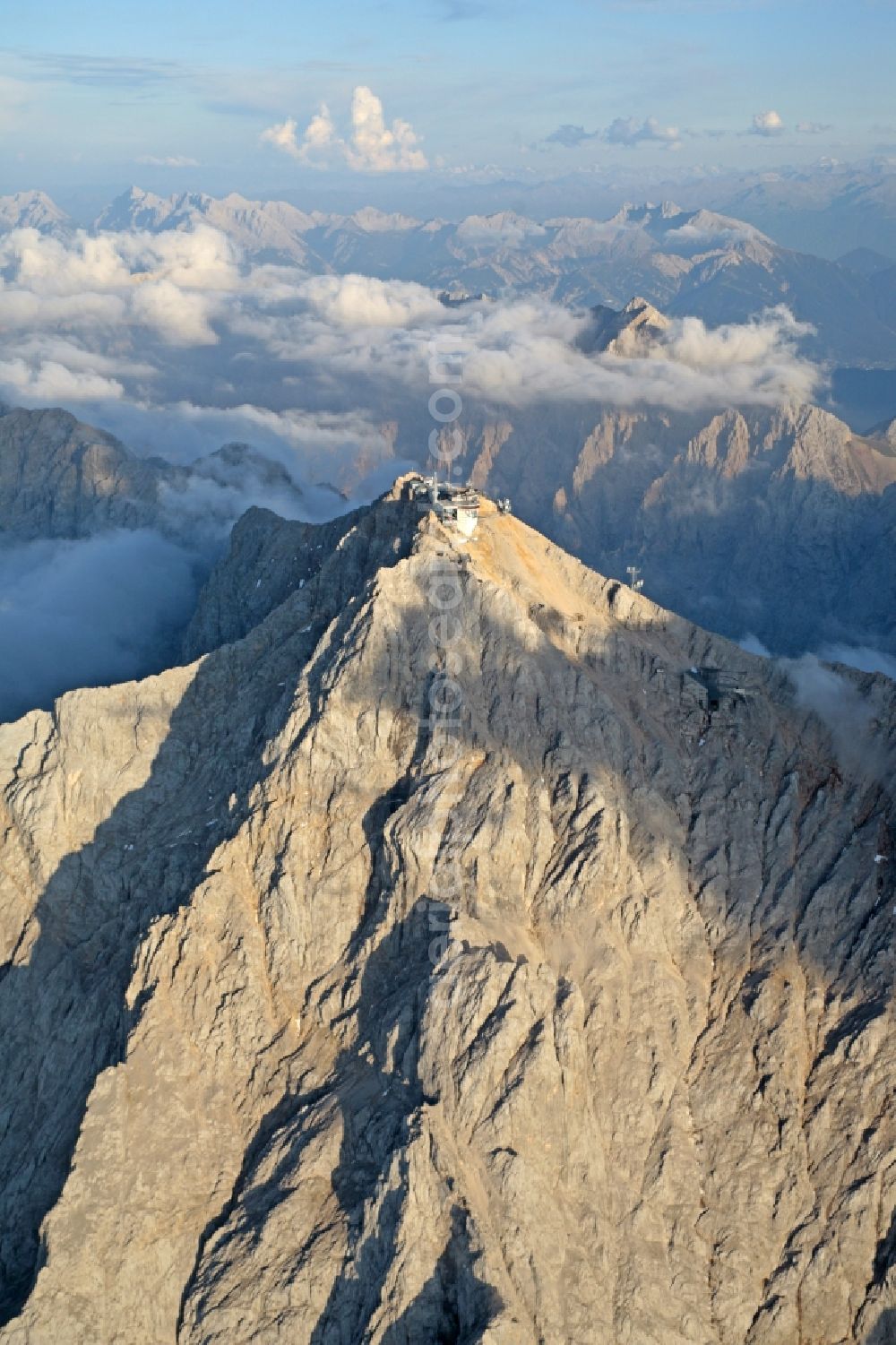 Garmisch-Partenkirchen from above - Cloud Covered summit of the Zugspitze mountain in the Alps near Garmisch-Partenkirchen in Bavaria