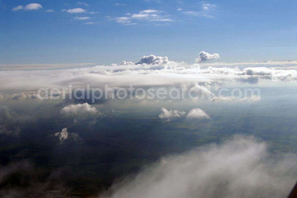 Aerial image Schöningen - Blick auf die Wolkenbildung bei einer Flughöhe von 3000 ft über dem Waldgebiet bei Schöningen. Schöningen ist eine Stadt im Landkreis Helmstedt am Höhenzug Elm. Sie liegt ca. elf Kilometer südwestlich der niedersächsischen Kreisstadt Helmstedt. Durch die Stadt führen die Deutsche Fachwerkstraße und die Deutsche Ferienroute Alpen-Ostsee.