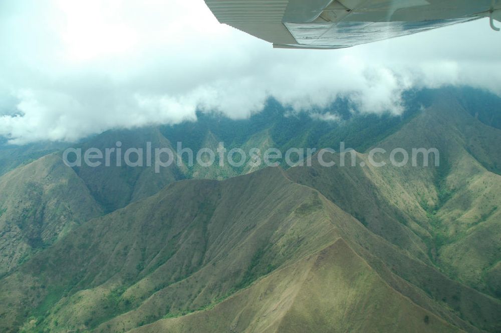 Aerial image Kigoma - Wolkenflug mit einem Buschflieger vom Typ Cessna C 182 über dem Gebirge von Kigoma. Cloud flying with a bush plane Cessna C 182 on the mountains of Kigoma