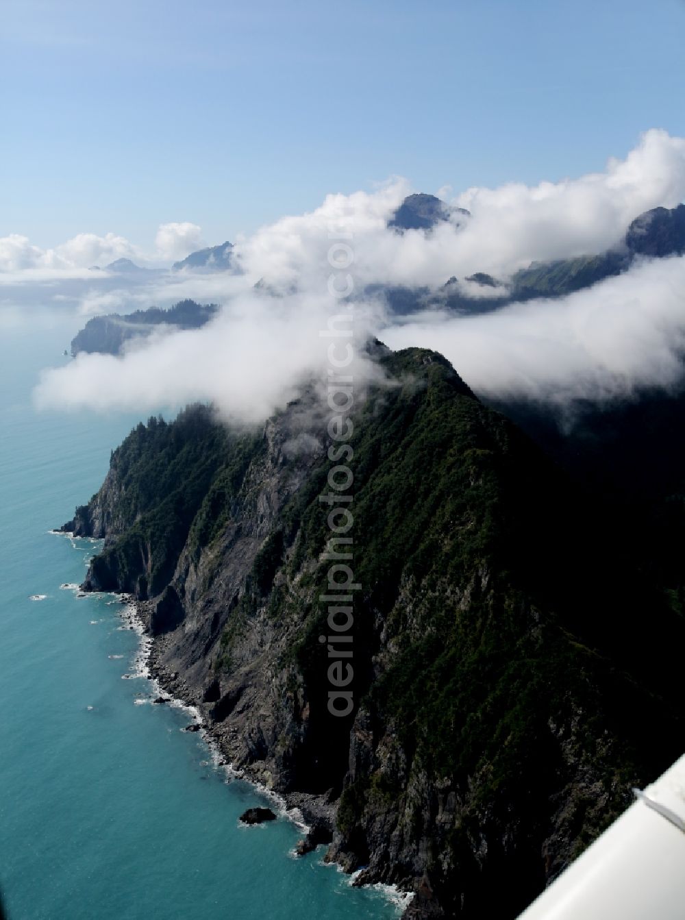 Kenai Fjords National Park from above - Cloud-shrouded mountain ranges in Seward Kenai Fjords National Park on the Kenai Peninsula in Alaska in the United States of America USA