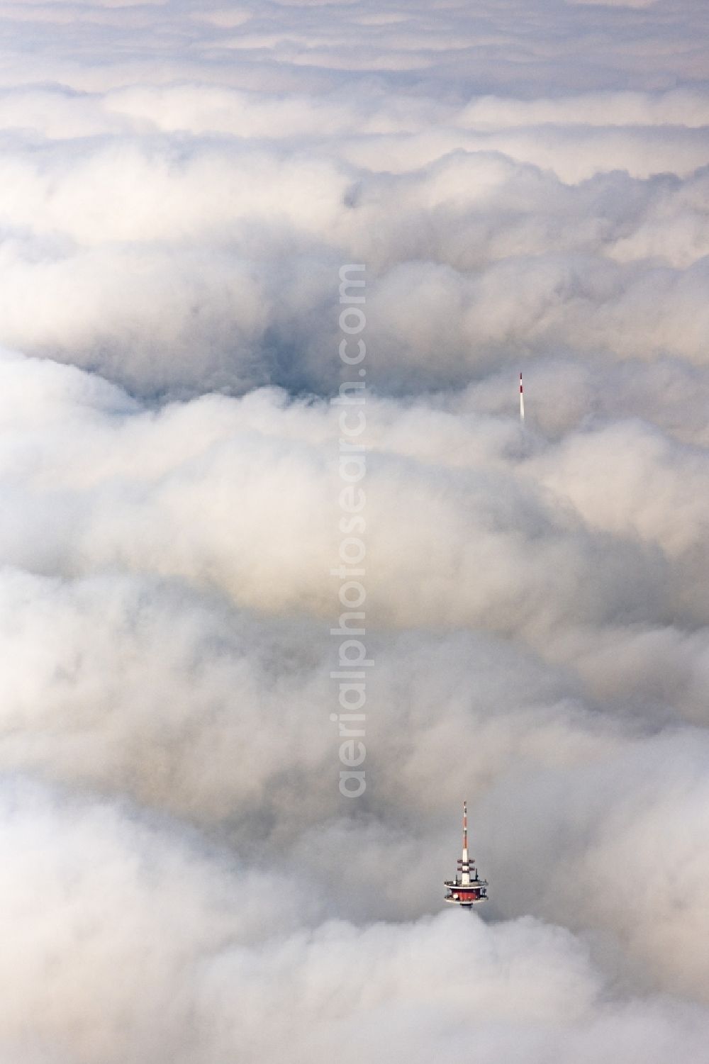 Burgsalach from the bird's eye view: Weather-dependent telecommunications tower structure and television tower enveloped by a layer of cloud in Burgsalach in the state Bavaria, Germany