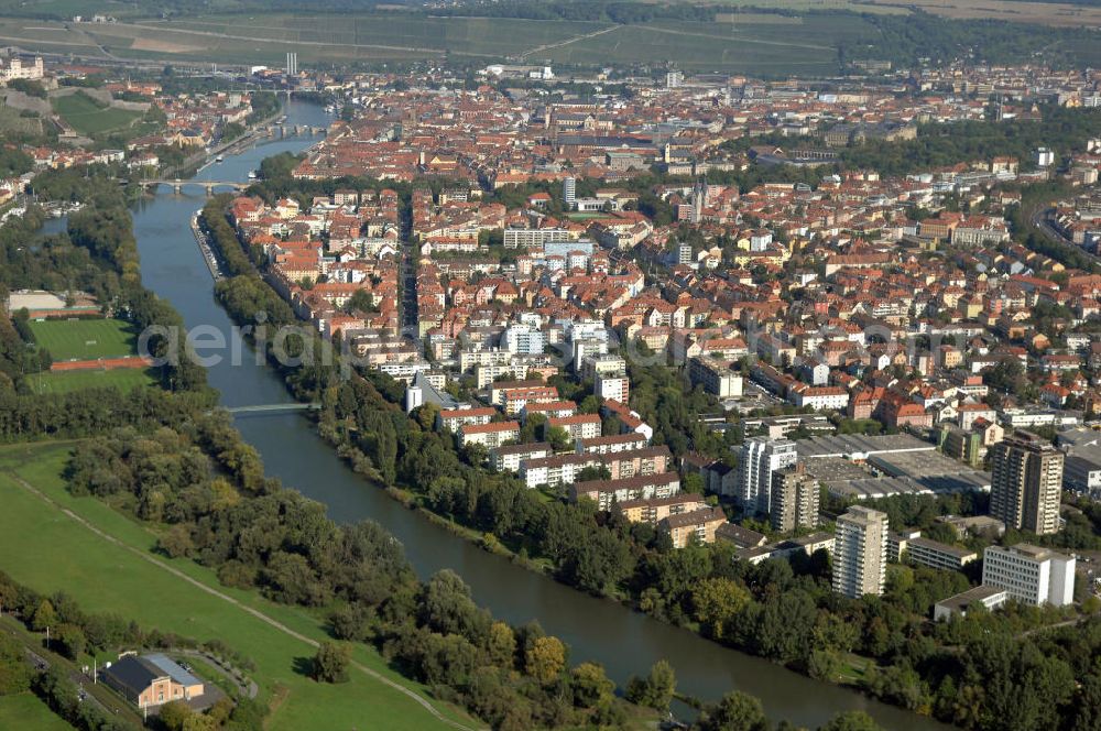 Aerial image WÜRZBURG - Würzburg 29.09.08 Blick über Würzburg mit der Fussgängerbrücke Sebastian-Kneipp-Steg, Ludwigsbrücke und der Alten Mainbrücke. Würzburg ist eine kreisfreie Stadt im bayerischen Regierungsbezirk Unterfranken mit Sitz der Regierung von Unterfranken, des Bezirks Unterfranken und des Landratsamtes Würzburg. Der Sebastian-Kneipp-Steg wurde am 22. Juli 1978 eingeweiht und ist eine reine Fußgängerbrücke. Die Ludwigsbrücke wurde 1895 erbaut und ist in der Bevölkerung wegen der vier Löwenstatuen an den beiden Auffahrten zur Brücke auch als Löwenbrücke geläufig. Die Alte Mainbrücke war bis 1886 der einzige Flussübergang. Sie wurde von 1476 bis 1703 erbaut und zeichnet sich durch Heiligenfiguren aus, die um 1730 hinzugefügt wurden. Kontakt: Stadt Würzburg, Rückermainstrasse 2, 97070 Würzburg, Tel. +49 (0)9 31 37-0, Fax +49 (0)9 31 37 33 73, e-mail: info@stadt.wuerzburg.de