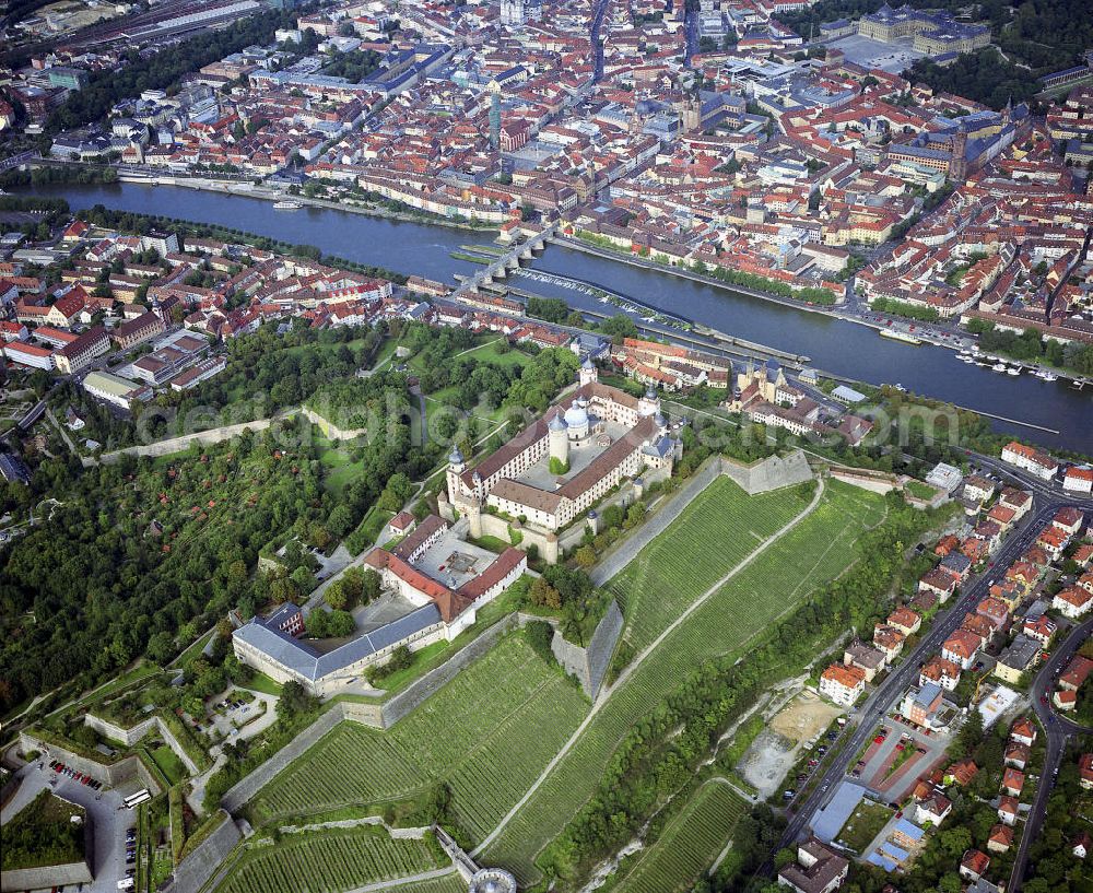 Aerial image Würzburg - Die Festung liegt etwa 100 Meter über dem Main. Sie wurde im Laufe ihrer Geschichte mehrmals umgebaut. Von 1253 bis 1719 war Marienberg die Residenz der Würzburger Fürstbischöfe. Im Hintergrund die fast komplette Würzburger Innenstadt. Die Stadt liegt im fränkischen Weinbaugebiet. Mit zahlreichen Bildungseinrichtungen (u. a. Universität), bedeutenden Industriebetrieben und dem Zentrum des Weinanbaus ist sie wirtschaftlicher und kultureller Mittelpunkt Unterfrankens.