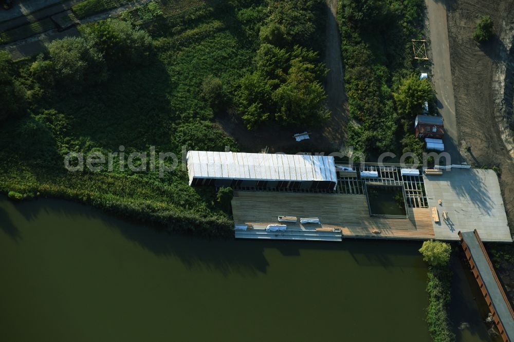 Aerial photograph Berlin - Lake Wuhleteich in Gaerten der Welt park on the premises of the IGA 2017 in the district of Marzahn-Hellersdorf in Berlin. Residential buildings and estates are located in the background along Eisenacher Strasse