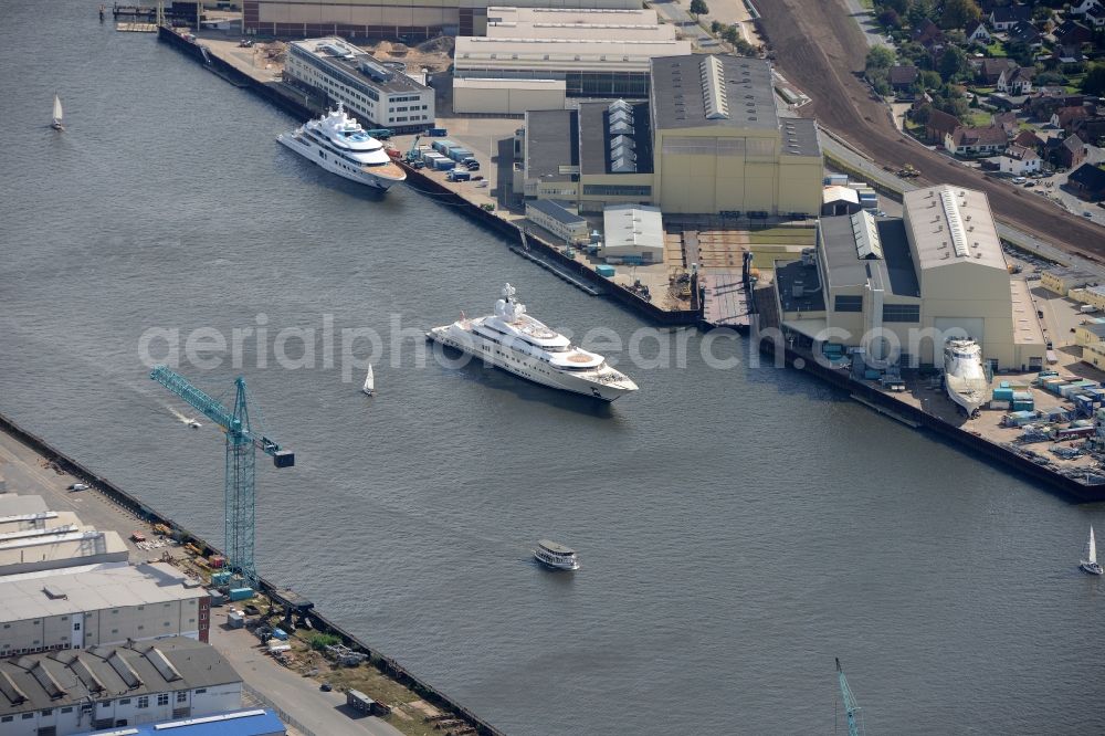 Aerial photograph Lemwerder - Yacht Pelorus on the river Weser in Lemwerder in the state of Lower Saxony in Germany. The yacht was built by Luerssen and is located in front of its docks