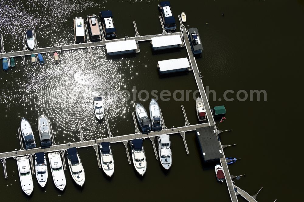 Buchholz from above - Pleasure boat and houseboot- marina with docks and moorings of marina Mueritzsee on the shore area of lake Mueritz in Buchholz in the state Mecklenburg - Western Pomerania