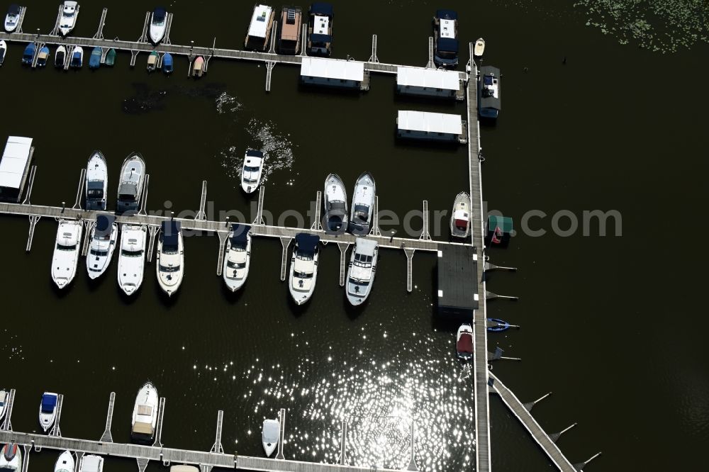 Buchholz from above - Pleasure boat and houseboot- marina with docks and moorings of marina Mueritzsee on the shore area of lake Mueritz in Buchholz in the state Mecklenburg - Western Pomerania