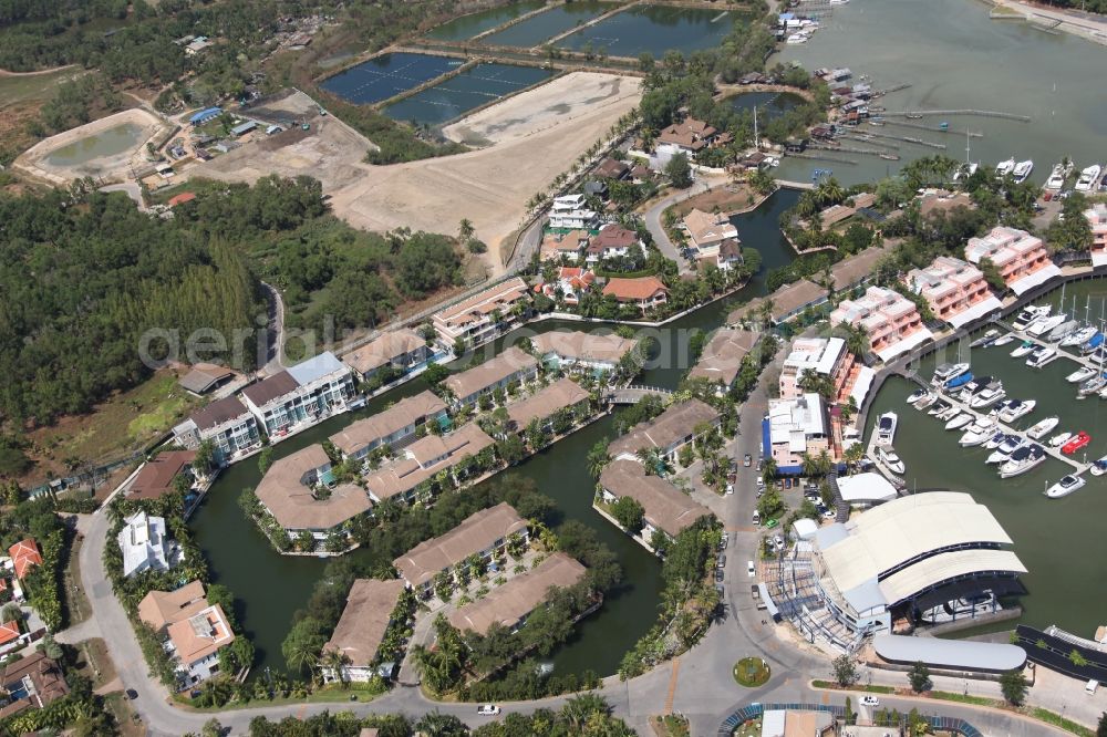 Koh Keaw from the bird's eye view: In Koh Kaew at Chuan Chuen Village on the island of Phuket a fashionable marina for sport boats and yachts has been developed with luxury resorts and hotels, the Phuket Boat Lagoon, also known as Royal Phuket Marina in Thailand