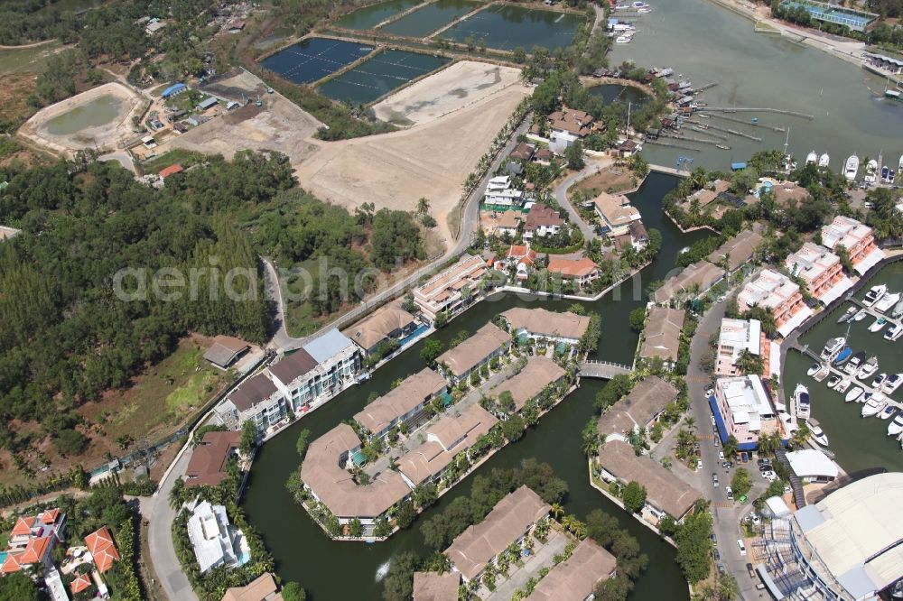 Aerial image Koh Keaw - In Koh Kaew at Chuan Chuen Village on the island of Phuket a fashionable marina for sport boats and yachts has been developed with luxury resorts and hotels, the Phuket Boat Lagoon, also known as Royal Phuket Marina in Thailand