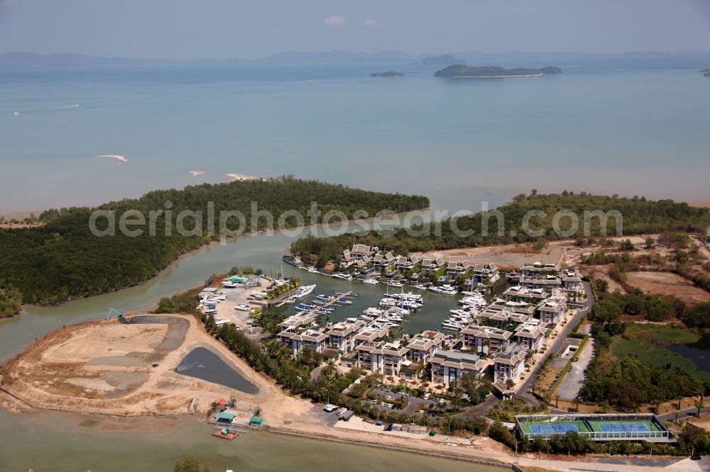 Koh Keaw from the bird's eye view: In Koh Kaew at Chuan Chuen Village on the island of Phuket a fashionable marina for sport boats and yachts has been developed with luxury resorts and hotels, the Phuket Boat Lagoon, also known as Royal Phuket Marina in Thailand