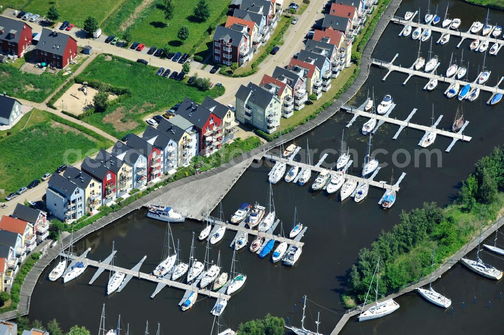 Aerial image Hansestadt Greifswald - Yachthafen Marina am Ryck und das Skandinavische Dorf am Nordufer an der Holzteichstraße in Greifswald / Mecklenburg-Vorpommern. Yacht harbour Marina at the Ryck and the Scandinavian village at the north bank in Greifswald / Mecklenburg-Western Pomerania. HanseYachts AG