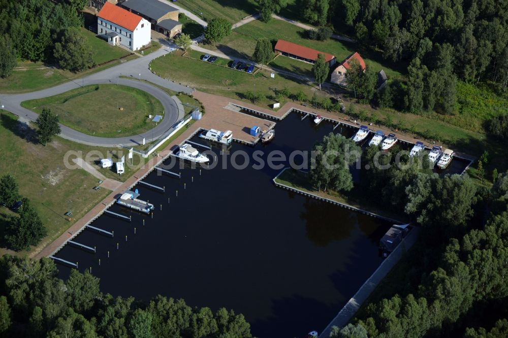 Aerial image Zehdenick - Yacht harbour and marina in the Mildenberg brick work park in the town area of Zehdenick in the state of Brandenburg. The park is an industrial memorial, surrounded by lakes and ponds. The compound consists of the company sites of two former brick works and is located in the North of the Mildenberg part of the town