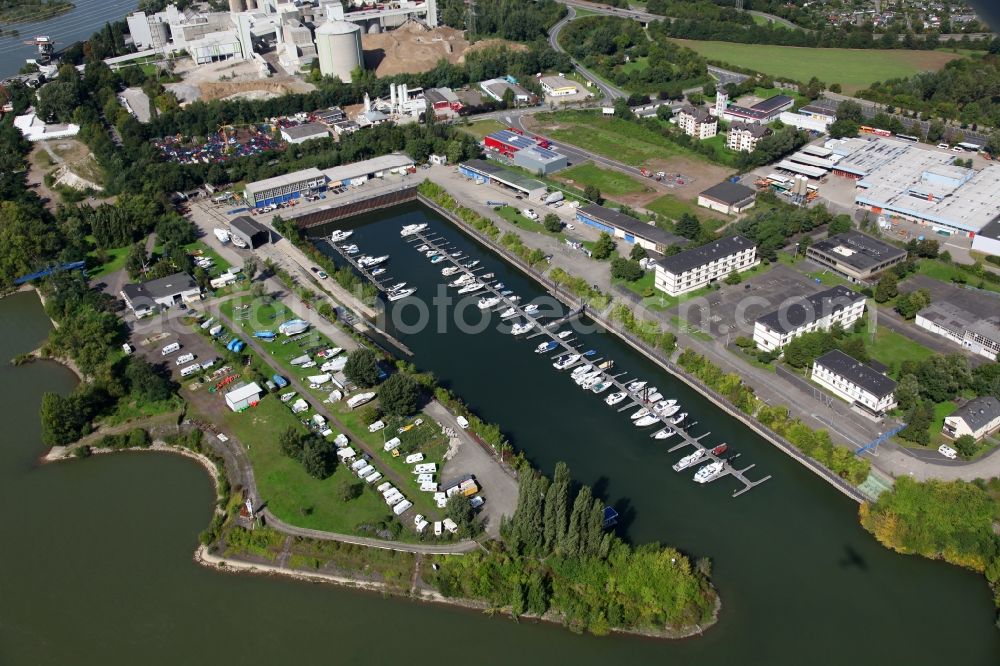 Aerial image Neuwied - View of the yacht harbour of Neuwied in the state of Rhineland-Palatinate. The harbour is located in a curve on the Northern riverbank of the Rhine. Camping facilities are on site as well. Behind the harbour, a cement factory with silos can be seen