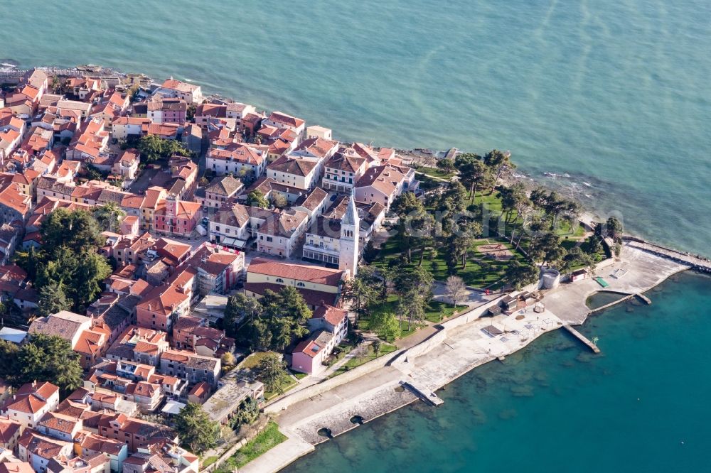 Aerial image Novigrad - Pleasure boat marina with docks and moorings on the shore area of the Adriatic sea and old town of Novigrad in Istirien - Istarska zupanija, Croatia