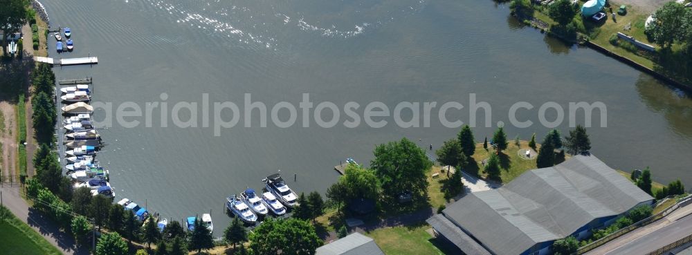 Aerial image Burg (bei Magdeburg) - Pleasure boat marina with docks and moorings on the shore area in Burg (bei Magdeburg) in the state Saxony-Anhalt