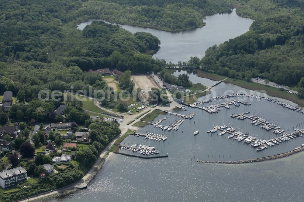 Glücksburg from above - Marina with recreational marine jetties and moorings on the shore area of the Flensburg Fjord in Gluecksburg in Schleswig-Holstein