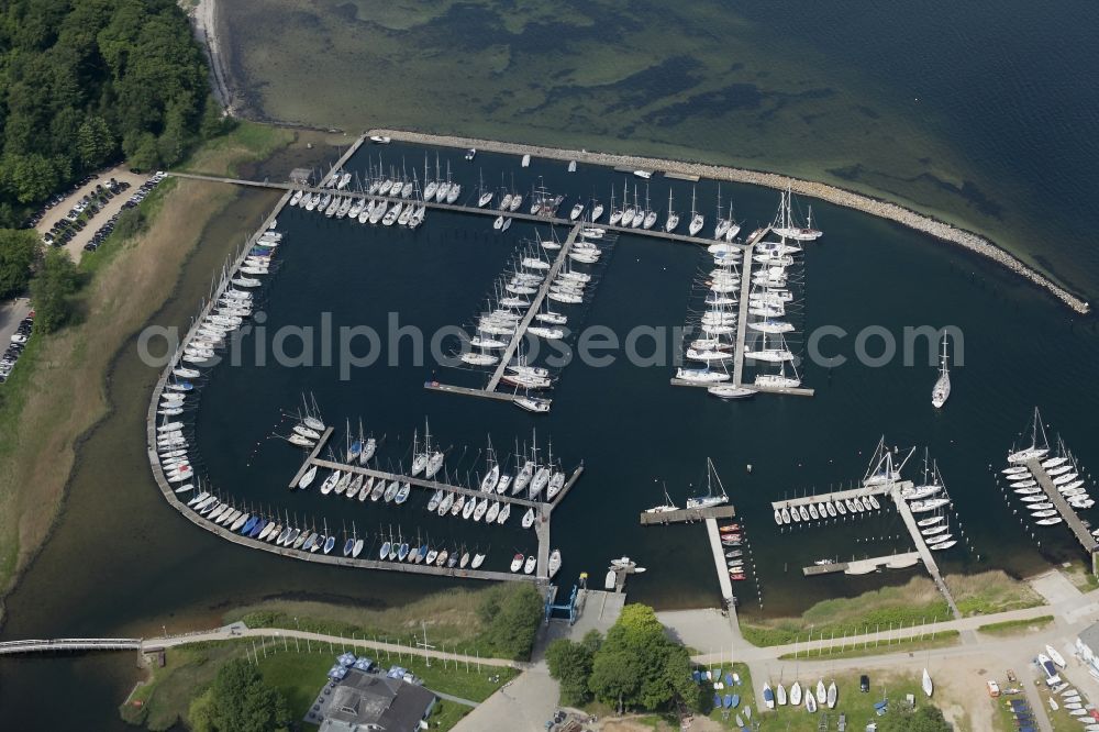 Glücksburg from the bird's eye view: Marina with recreational marine jetties and moorings on the shore area of the Flensburg Fjord in Gluecksburg in Schleswig-Holstein