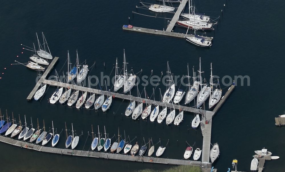 Glücksburg from above - Marina with recreational marine jetties and moorings on the shore area of the Flensburg Fjord in Gluecksburg in Schleswig-Holstein