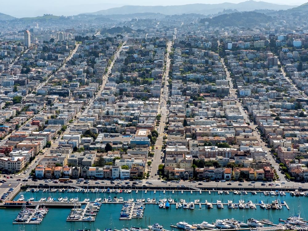 Aerial image San Francisco - Pleasure boat marina with docks and moorings on the shore area St. Francis Yacht Club 99 Yacht Rd in San Francisco in USA. In the background, roads and residential areas of Divisadero Street, Scott street and Broderick street