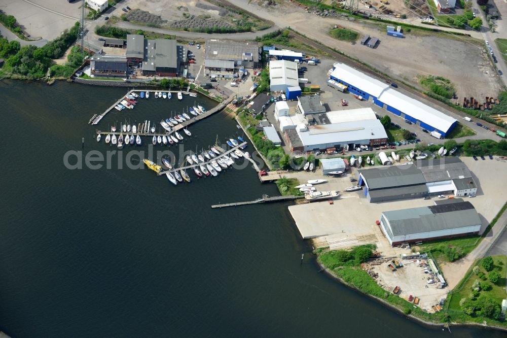 Lübeck from the bird's eye view: Pleasure boat marina with docks and moorings on the shore area in Luebeck in the state Schleswig-Holstein