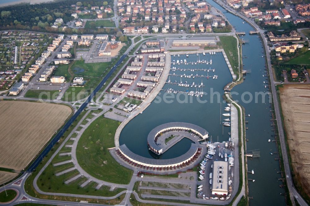 Aerial image Casalborsetti - Pleasure boat marina with docks and moorings on the shore area Marina di Porto Reno in Casalborsetti in Emilia-Romagna, Italy