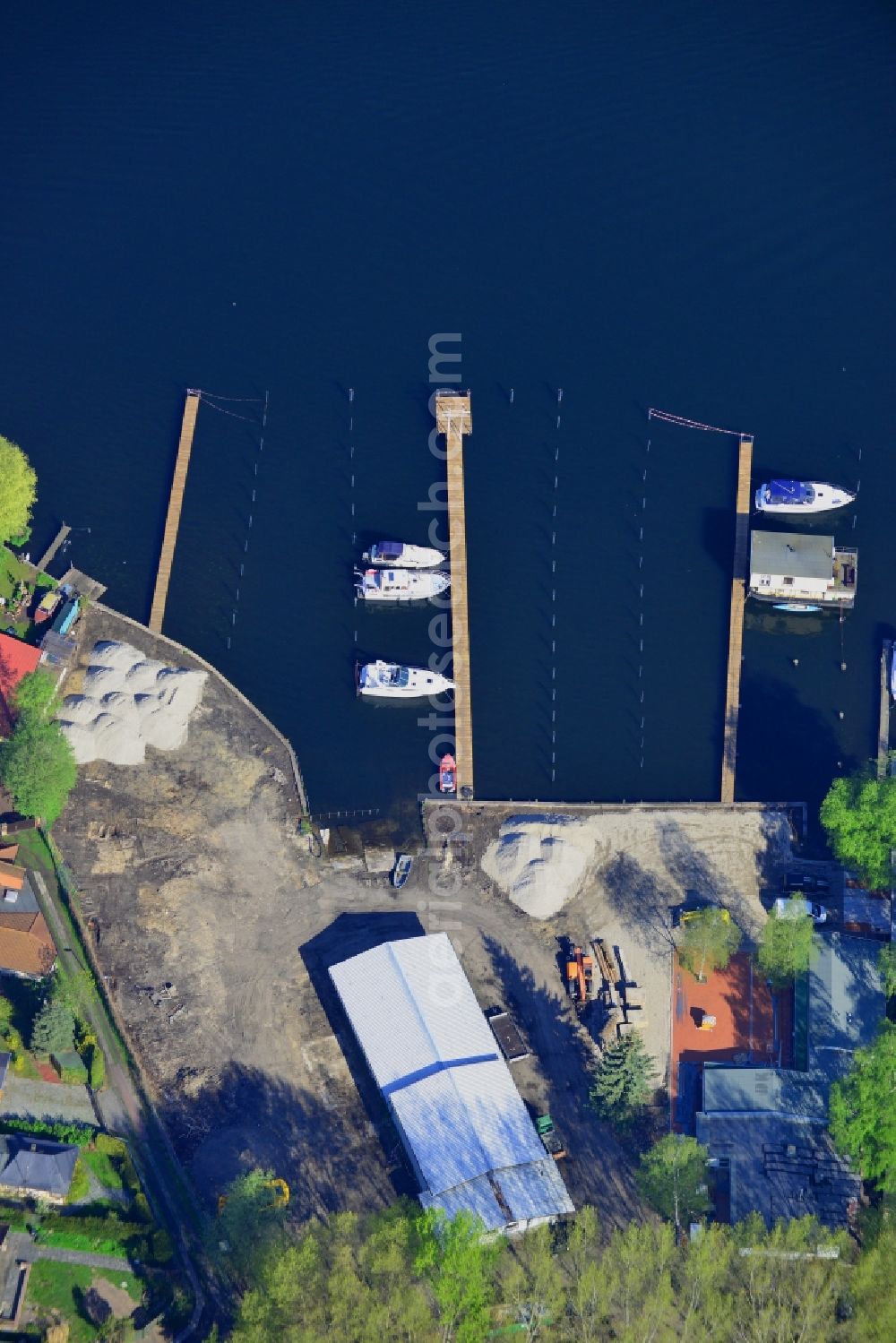 Berlin from above - Pleasure boat marina with docks and moorings on the shore area in Berlin in Germany