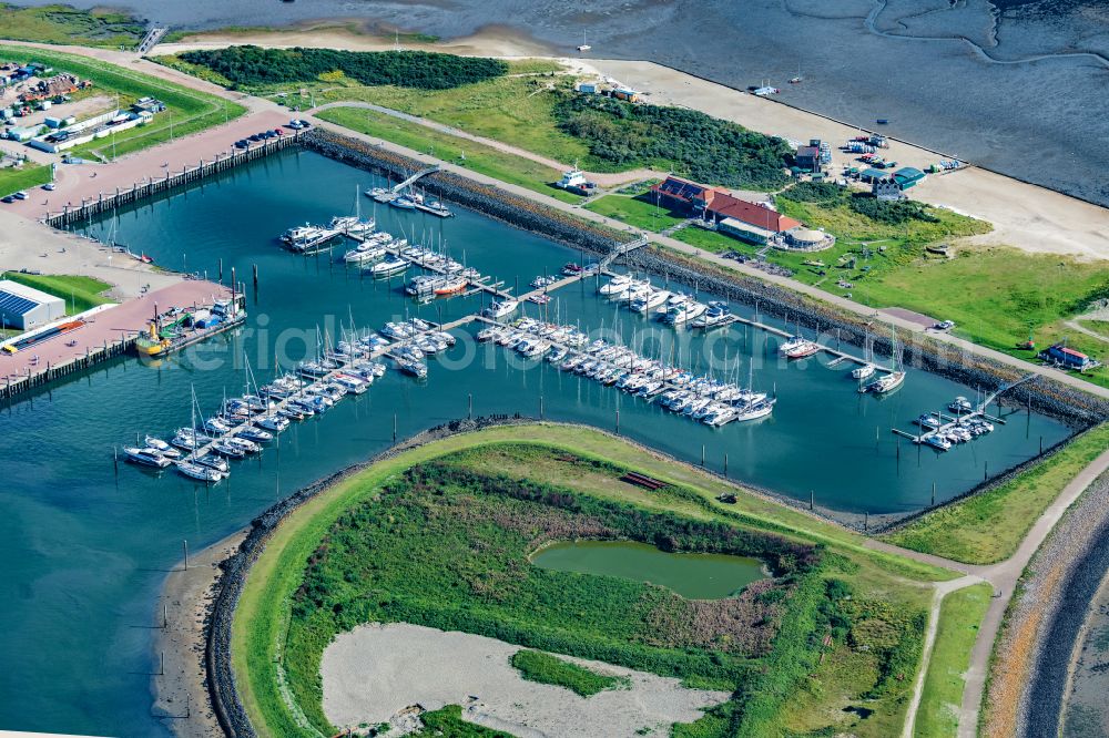 Aerial image Norderney - Pleasure boat marina with docks and moorings on the shore area in Norderney in the state Lower Saxony, Germany