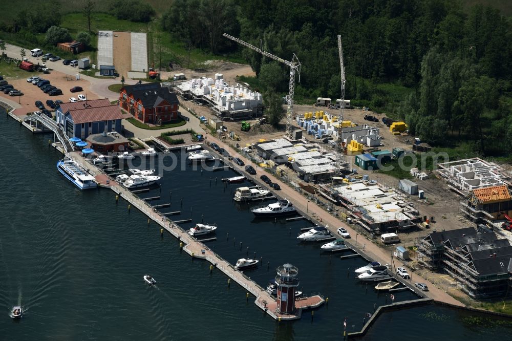 Plau am See from the bird's eye view: Pleasure boat marina with docks and moorings on the shore area of Plauer See in Plau am See in the state Mecklenburg - Western Pomerania