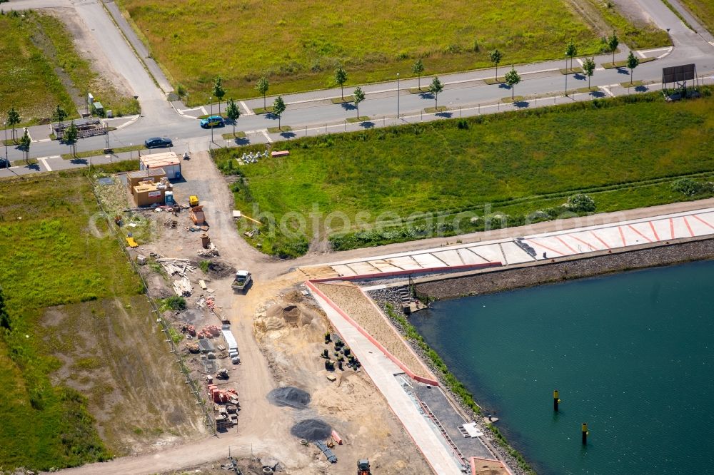 Gelsenkirchen from the bird's eye view: Pleasure boat marina with docks and moorings on the shore area des Rhein-Herne-Kanal on the grounds of the former Graf Bismarck colliery in Gelsenkirchen in the state North Rhine-Westphalia