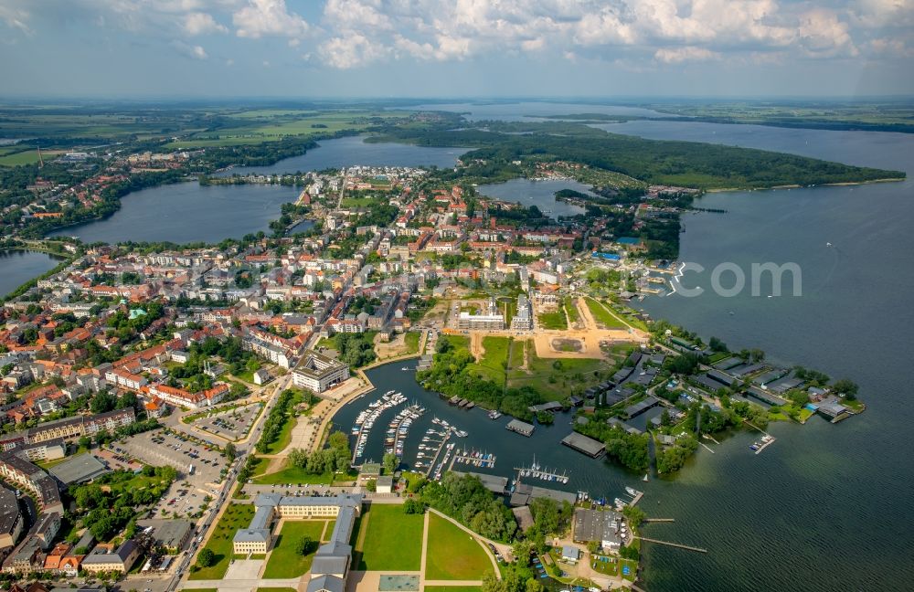 Schwerin from the bird's eye view: Pleasure boat marina with docks and moorings on the shore area of lake Schweriner Innensees in Schwerin in the state Mecklenburg - Western Pomerania