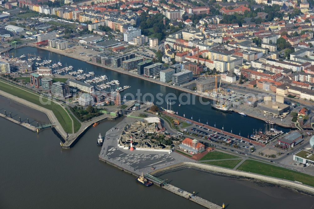 Bremerhaven from the bird's eye view: Pleasure boat marina with docks and moorings on the shore area of the river Weser and nearby residential areas beneath the road B212 in Bremerhaven in the state Bremen