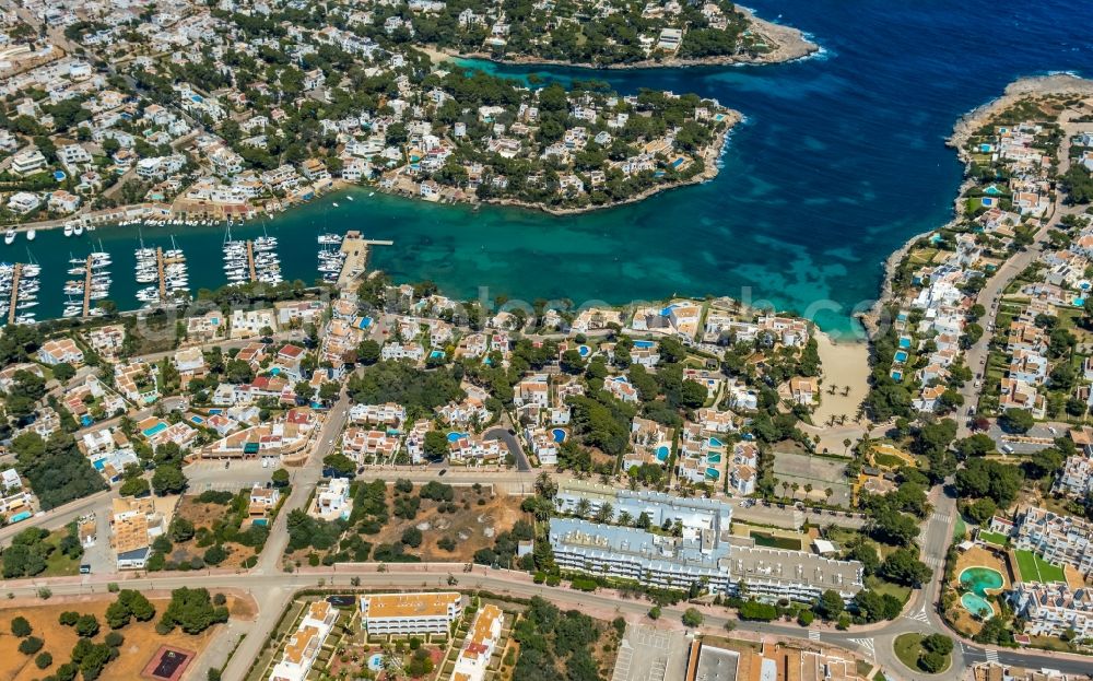 Aerial image Santanyi - Pleasure boat marina with docks and moorings on the shore area of the bay Cala Llonga in Santanyi in Balearic island of Mallorca, Spain